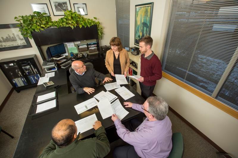 Ryerson employees holding a meeting in a conference room